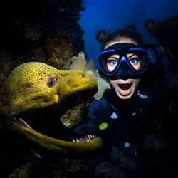 Scuba diver imitates an eel