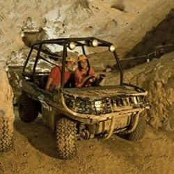 Couple drive through a cavern at Xplor Fuego